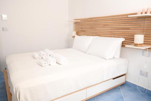 a bedroom with a white bed with towels on it at Fountain House Sorrento in Sant'Agnello