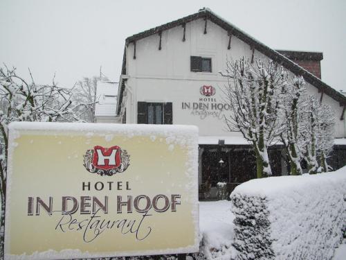 a sign for a hotel in den hocoren in the snow at Hotel Restaurant in den Hoof in Maastricht
