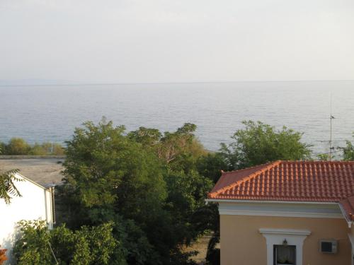 a view of the ocean from a house at NICK STUDIOS previous NICK HOUSE in Plomarion