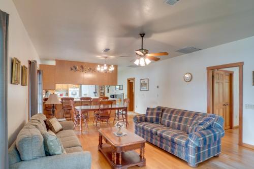 a living room with a couch and a table at Beautiful Toledo Bend Retreat with Private Dock in Many