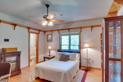 a bedroom with a bed and a ceiling fan at Beautiful Toledo Bend Retreat with Private Dock in Many