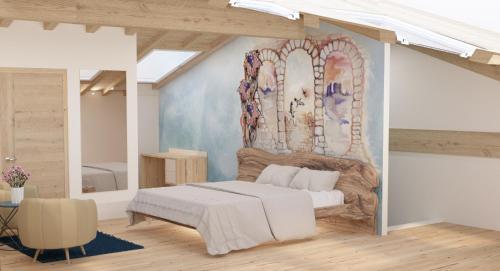 um quarto com uma cama e um quadro na parede em BIOAGRITURISMO FALEZZE em Lione