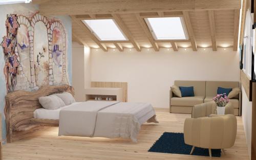 um quarto com uma grande cama branca e um sofá em BIOAGRITURISMO FALEZZE em Lione
