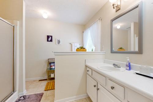 a bathroom with a sink and a mirror at Wildwood Retreat in Hiram