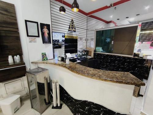 Kuchyň nebo kuchyňský kout v ubytování Hotel Mãe Rainha