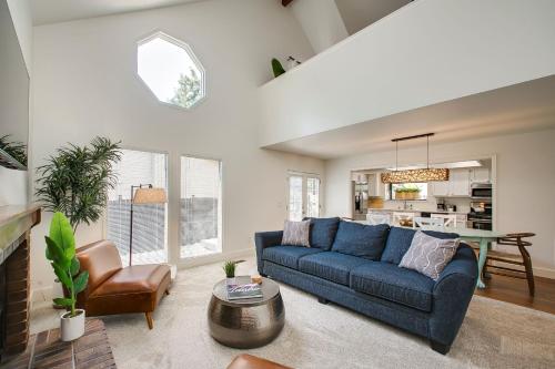 a living room with a blue couch and a table at Come stay at the Elm Grove Elegance Irene! in Boise