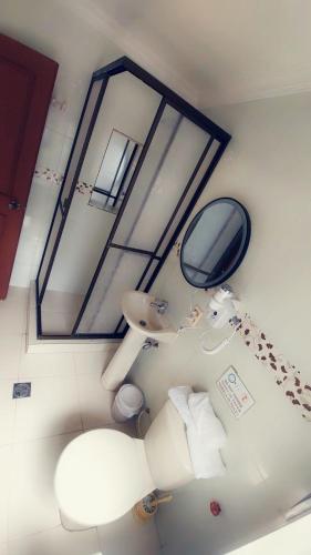 an overhead view of a bathroom with a mirror and a sink at Anami Hotel Boutique in La Paz