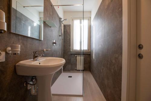 a bathroom with a sink and a shower at Hotel dell'Angelo in Predore