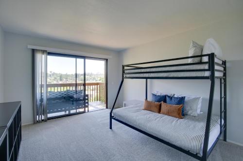 a bedroom with a bunk bed and a balcony at La Mesa Townhome 15 Mi to San Diego! in La Mesa