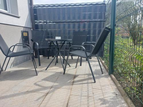 a group of chairs and a table on a patio at SPRING and SUMMER apartment near Ljubljana with FREE secure parking in Domžale