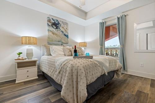 a bedroom with a bed and a window at Calypso 3 New Relax Unwind Luxury PCB next to Pier Park 3 Bed 2 Bath Pool Hot Tub Tikki bar in Panama City Beach