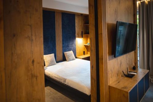 Katil atau katil-katil dalam bilik di Apartament Loft Mazury
