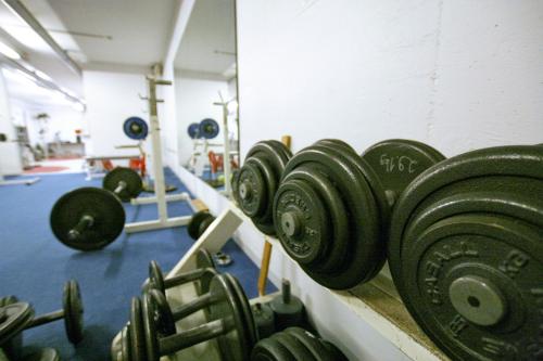 a row of dumbbells in a gym at Skyline Airport Hotel in Vantaa