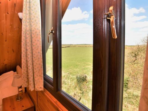 an open window with a view of a field at 2 bed in Launceston TWIME in Saint Clether