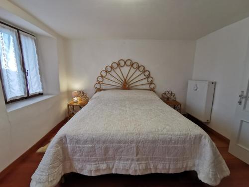 Postel nebo postele na pokoji v ubytování La casa nel borgo