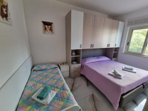 Postel nebo postele na pokoji v ubytování San Marco Beach App Maestrale