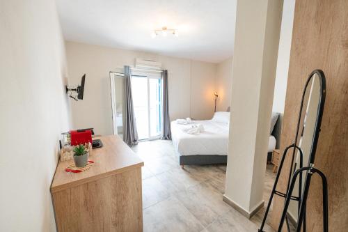 Postel nebo postele na pokoji v ubytování XENIOS APARTMENTS