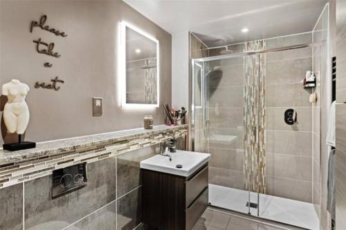 a bathroom with a shower and a sink at St Chloe in Layer de la Haye