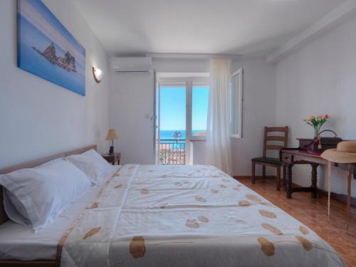 Postel nebo postele na pokoji v ubytování Casa Pastrovici del Mare