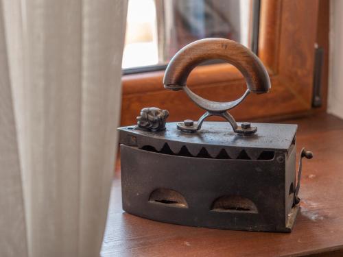 an old stove sitting on top of a wooden floor at Casa Pastrovici del Mare in Petrovac na Moru