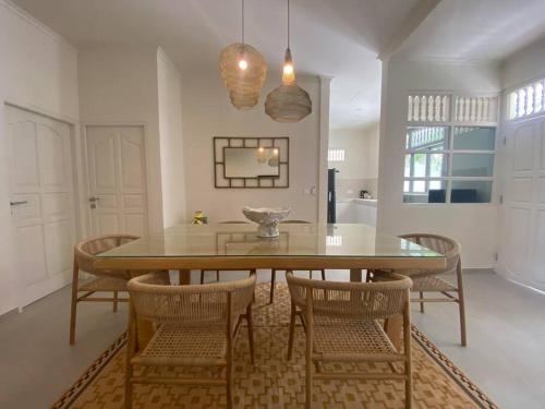 a dining room with a table and chairs at Villa EL NIS - LEGIAN - 4 Bedroom - 4 Bathroom - Luxury in Legian
