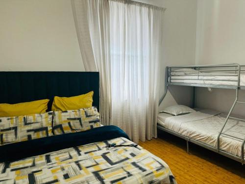 a bedroom with two bunk beds and a window at Peaceful getaway in Cape Town