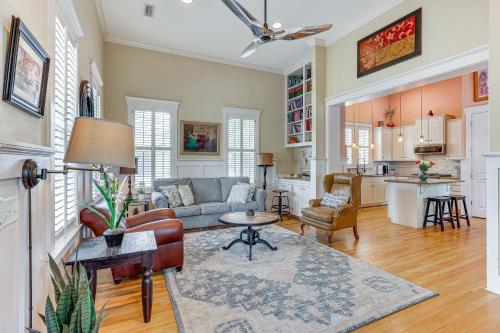 a living room with a couch and a table at Charming Wilmington Cottage - Walk to Downtown! in Wilmington