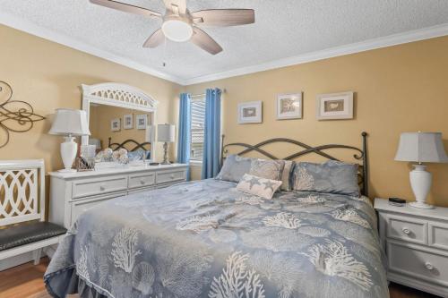 a bedroom with a bed and a ceiling fan at Sea Breeze 311 in Gulf Shores