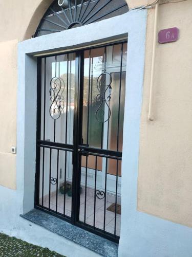 a door with a iron gate on a building at Discesa Marina in Ventimiglia