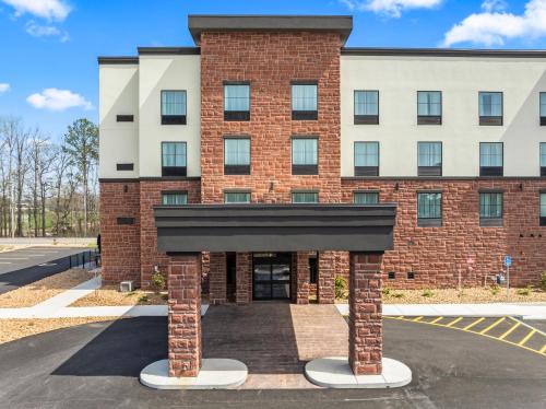 a rendering of the front of a brick building at Cobblestone Hotel & Suites - Cullman in Cullman