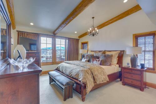 a bedroom with a bed and a desk and windows at Edwards Home in Cordillera Hot Tub, Mountain View in Edwards