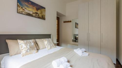 Postel nebo postele na pokoji v ubytování Porta Nuova - Centro Elegante Suite con Wi-Fi