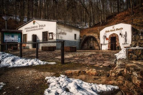 a couple of buildings with snow on the ground at Hotel & Restaurant Pod Kaštany in Krupka - Marsov