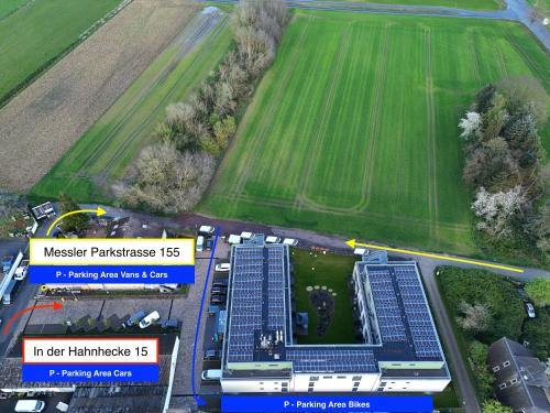 an aerial view of a field and a building at Fair´n Square Hotel 24 Stunden Check In in Darmstadt