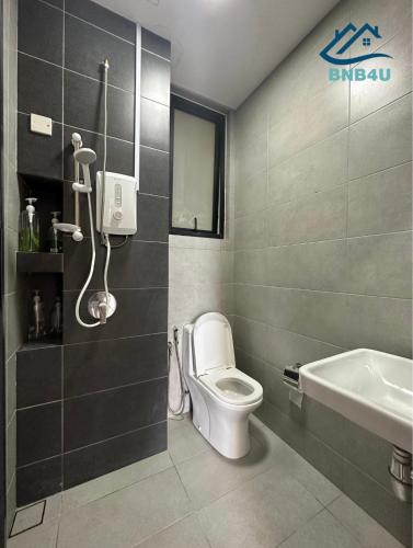 a bathroom with a toilet and a sink at Urban Suites @ George Town Penang by BNB4U in George Town