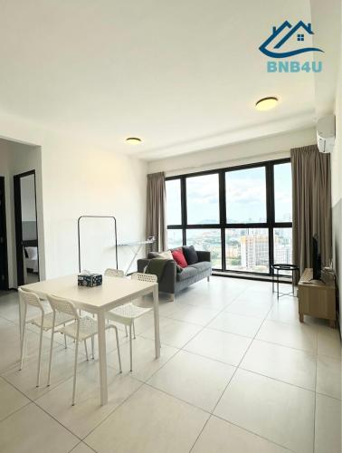 a living room with a white table and chairs at Urban Suites @ George Town Penang by BNB4U in George Town