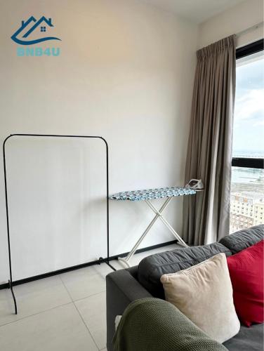 a living room with a couch and a table at Urban Suites @ George Town Penang by BNB4U in George Town