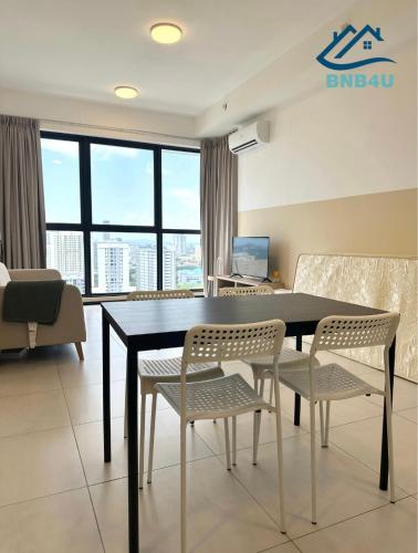 a dining room with a table and chairs at Urban Suites @ George Town Penang by BNB4U in George Town