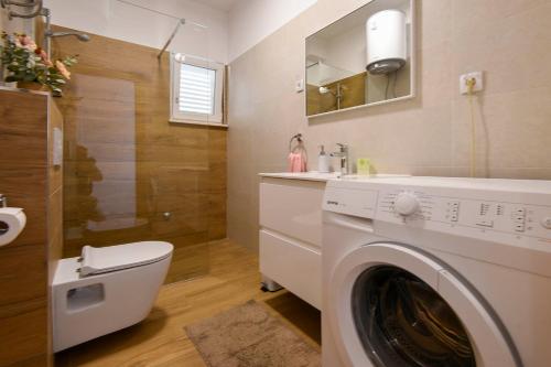 Koupelna v ubytování Apartments Goga