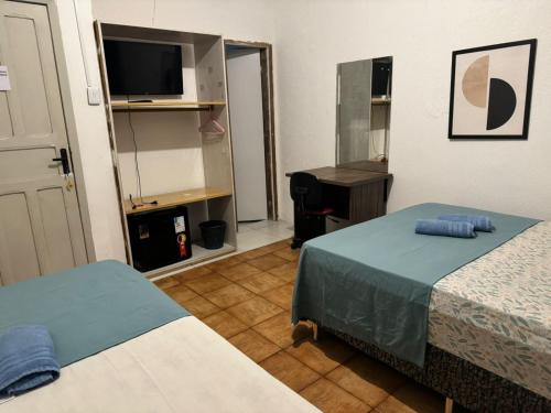 Katil atau katil-katil dalam bilik di Casa do Meio Pousada