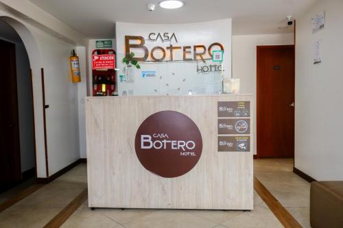 a csa brother store with a sign on a counter at Hotel Casa Botero 202 in Bogotá