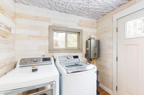 a laundry room with a washer and dryer at Whispering Trees in Fish Camp
