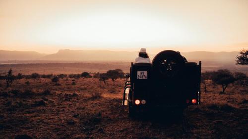 a bus parked in the desert with the view at Umkhaya lodge in Mkuze