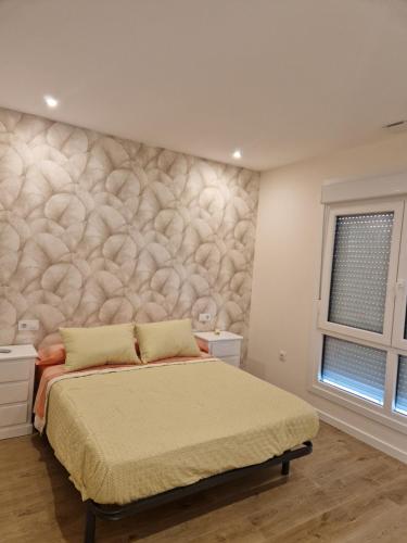 Ένα ή περισσότερα κρεβάτια σε δωμάτιο στο Apartaments Mariña A5