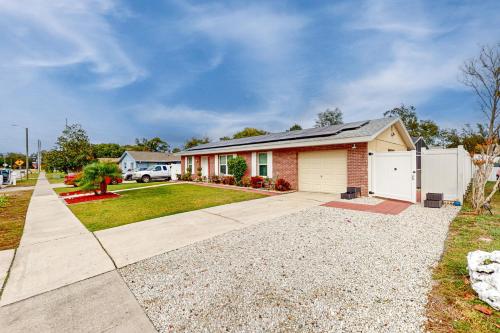 a house with a driveway and a garage at Pool Access! Dog-Friendly Retreat 16 Mi to Orlando in Orlando