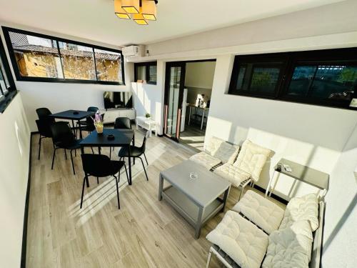 a living room with a couch and a table at Central Old Town Oasis - Ap 10 in Bucharest