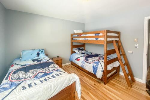 a bedroom with a bunk bed and a ladder at Waterville Vacation Condo in Waterville Valley