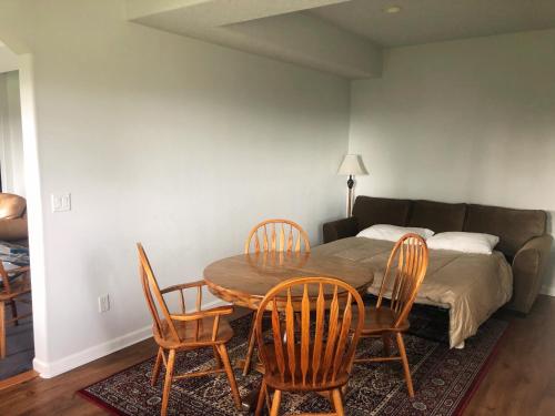 a room with a table and chairs and a bed at 2 Bedroom Suite: Views, Private Entrance, EVchgr in Amity