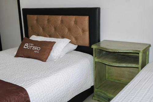 Una cama o camas en una habitación de Hotel Casa Botero 302