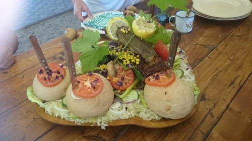 a plate of food with tomatoes and vegetables on a table at Tanzanit in Štúrovo
